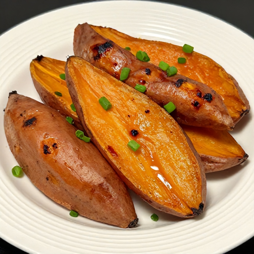 Plated honey roasted sweet potatoes with green onions
