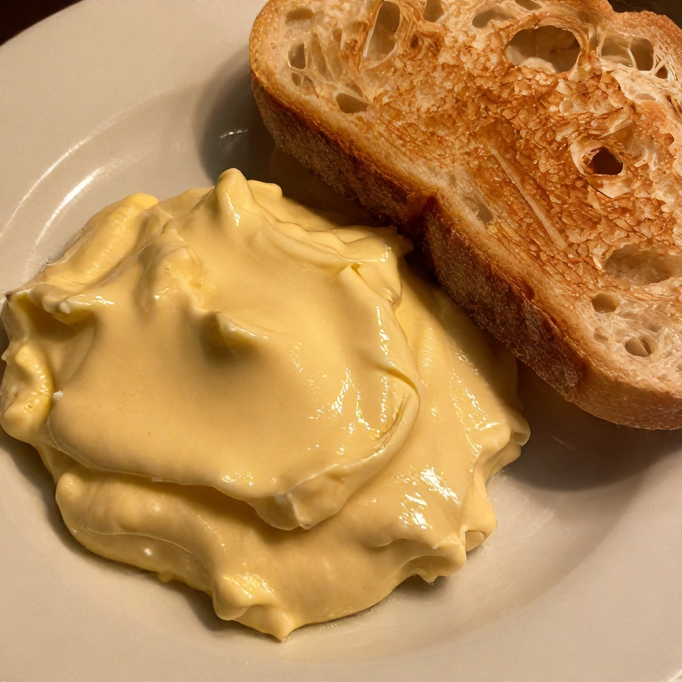 Garlic Aioli served on a plate with fresh bread